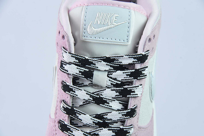 the nike dunk low appears in pink and grey suede dv3054-600